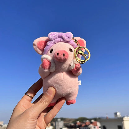 Cute stuffed pig with purple headband full front view white background