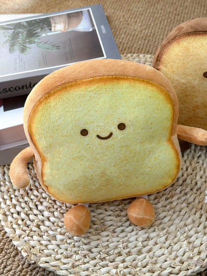 Cute toast cushion styled as kawaii room decor on a pastel pink desk