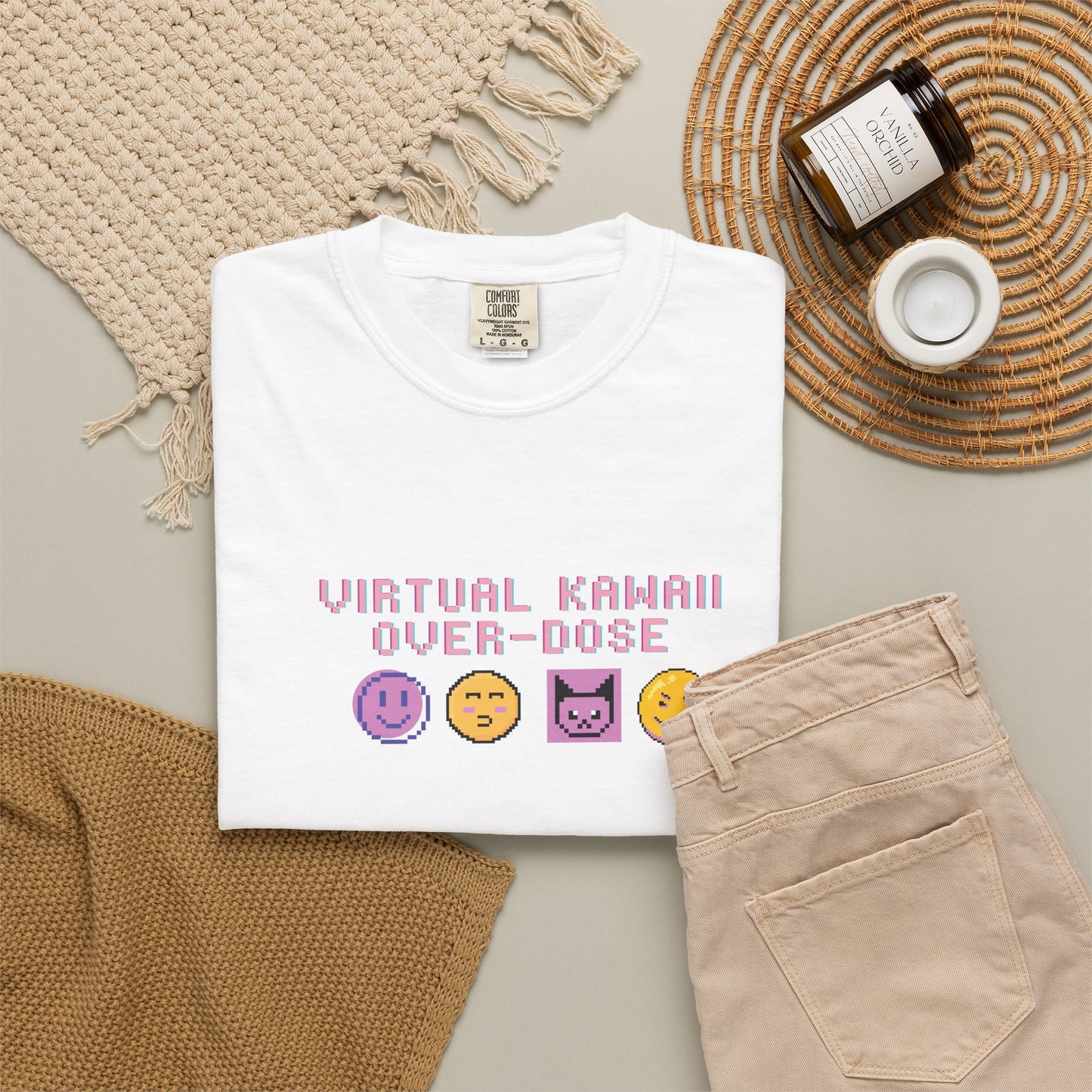 Cyber kawaii graphic tee styled in a Y2K flat lay with handheld console and accessories

