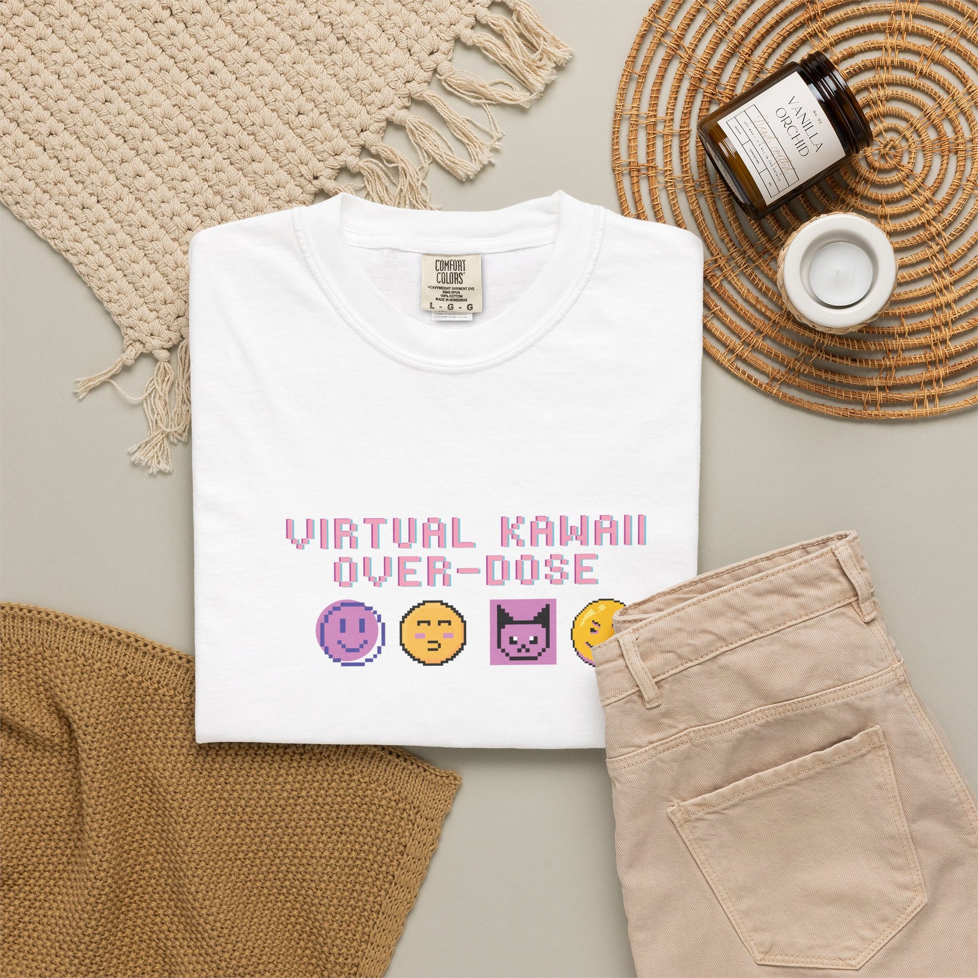 Cyber kawaii graphic tee styled in a Y2K flat lay with handheld console and accessories
