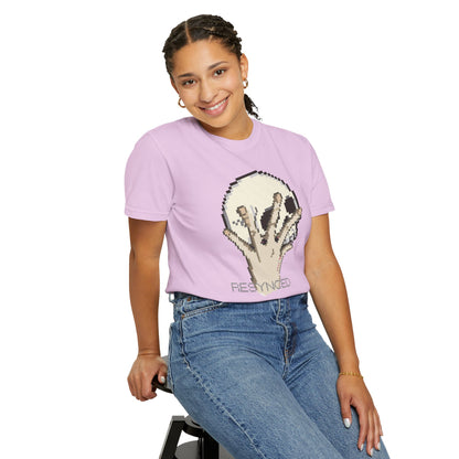 Cybernetic graphic tee melting skull print close-up pixel fragmentation detail
