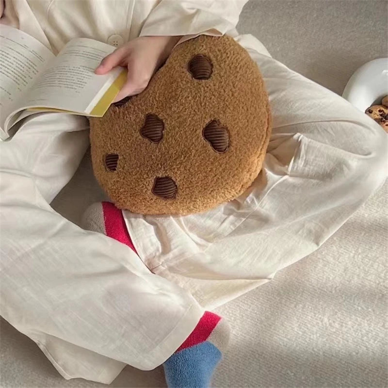 Decorative food pillow cookie plush on a minimalist desk with plant decor