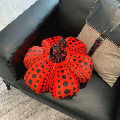Decorative gourd cushion displayed on a minimalist bedroom bookshelf