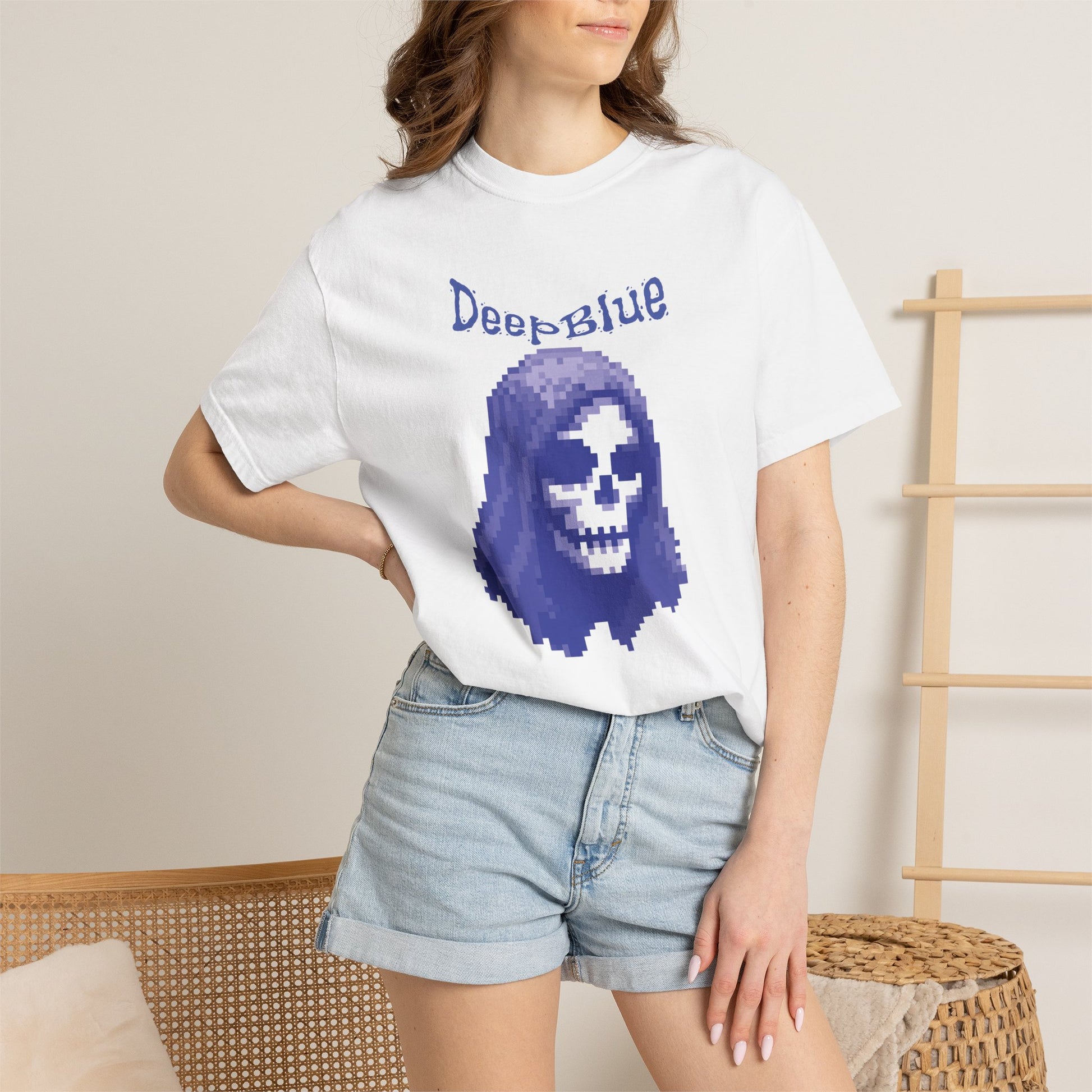 Deep Blue pixel pirate graphic shirt hanging on black metal rack
