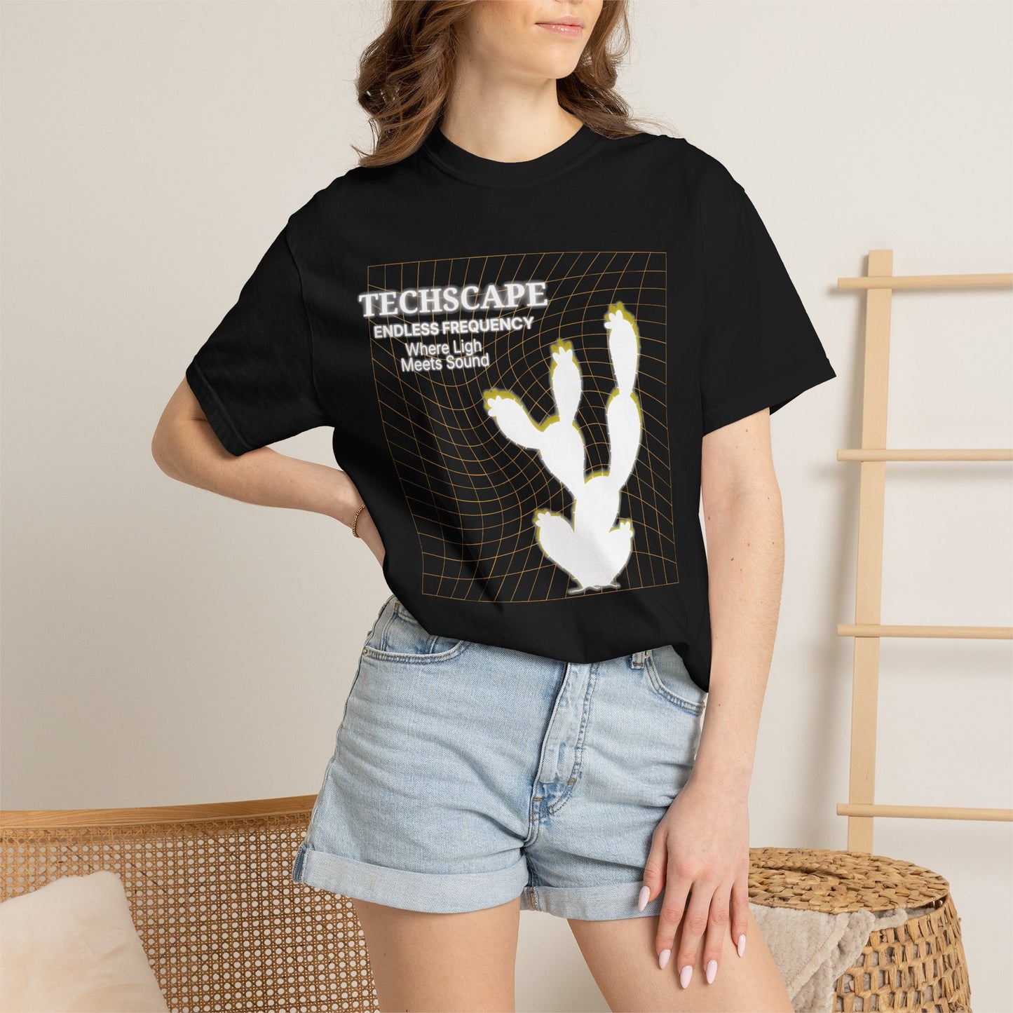 Desert minimalism apparel Techscape tee worn with joggers and cap, street style