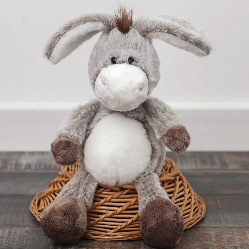 Donkey cuddle toy positioned beside other farmyard plush companions