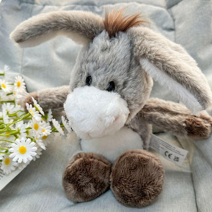 Donkey stuffed toy side profile showing tail and ear detail