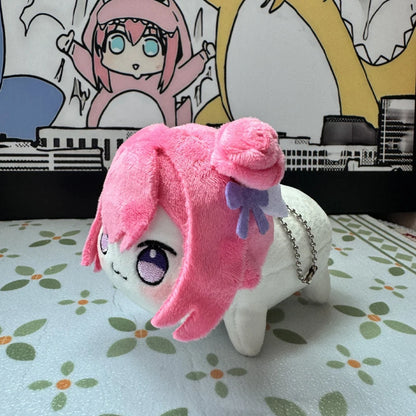 Doro plush charm hanging from a lanyard at an anime convention