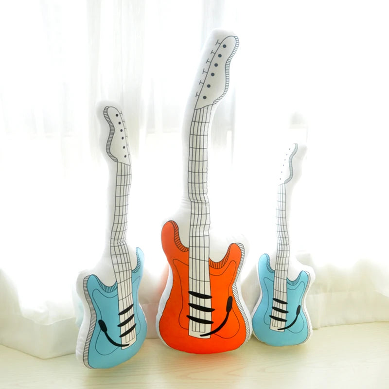 Double sided guitar shaped stuffed pillow showing orange and blue color variants