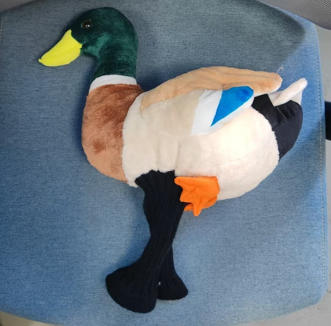 Duck plush duo on golf course grass fairway display