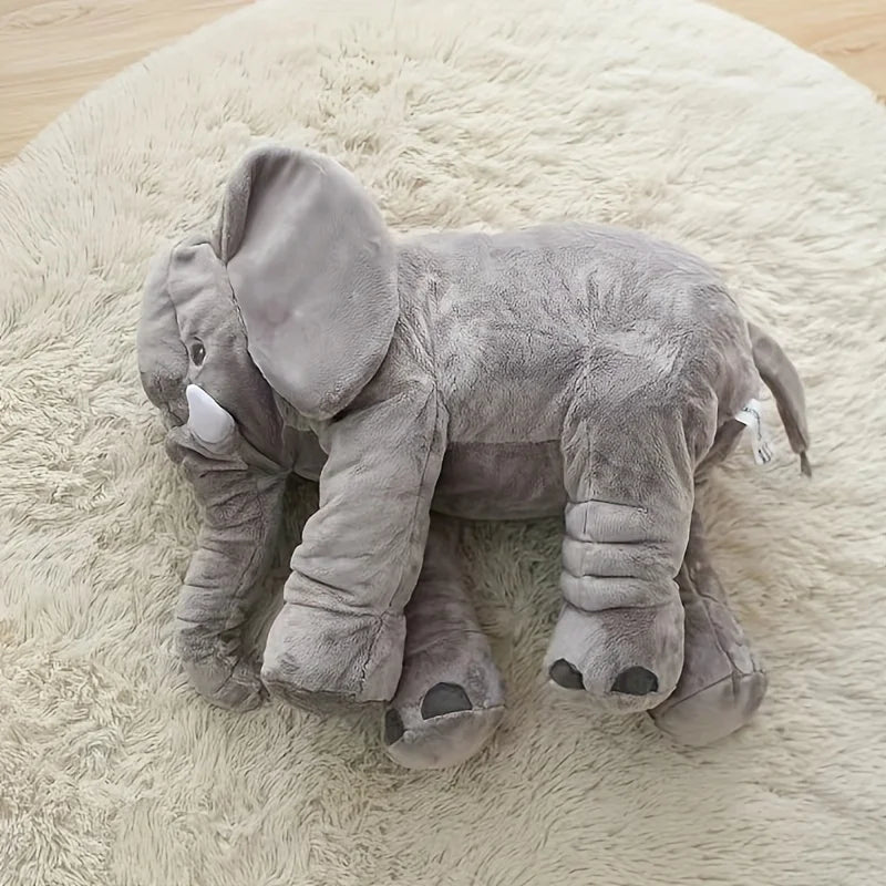Elephant sleep companion tucked into a crib corner