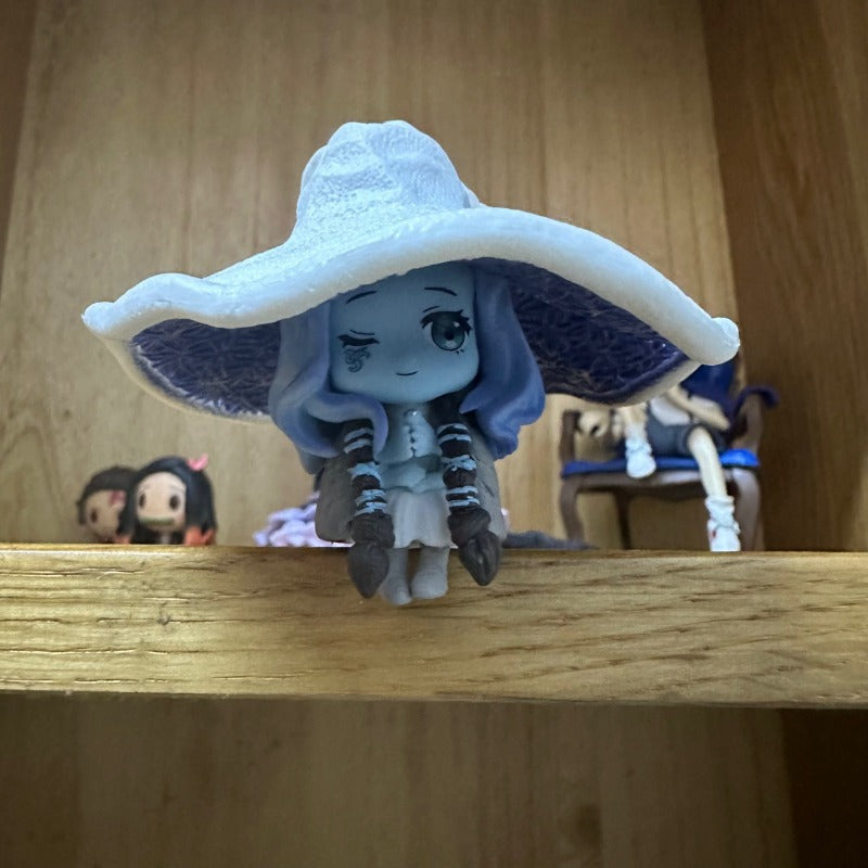 Fantasy game witch figurine with elaborate sorcery-inspired costume design
