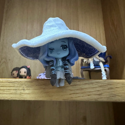 Fantasy game witch figurine with elaborate sorcery-inspired costume design
