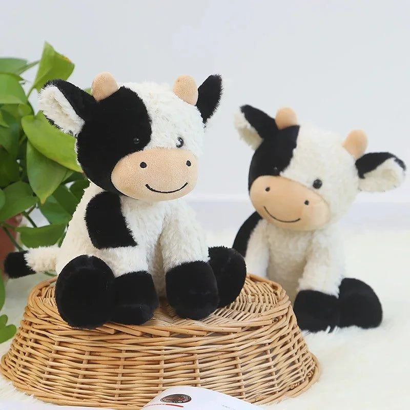 Farm animal plush seated cow toy isolated on white background