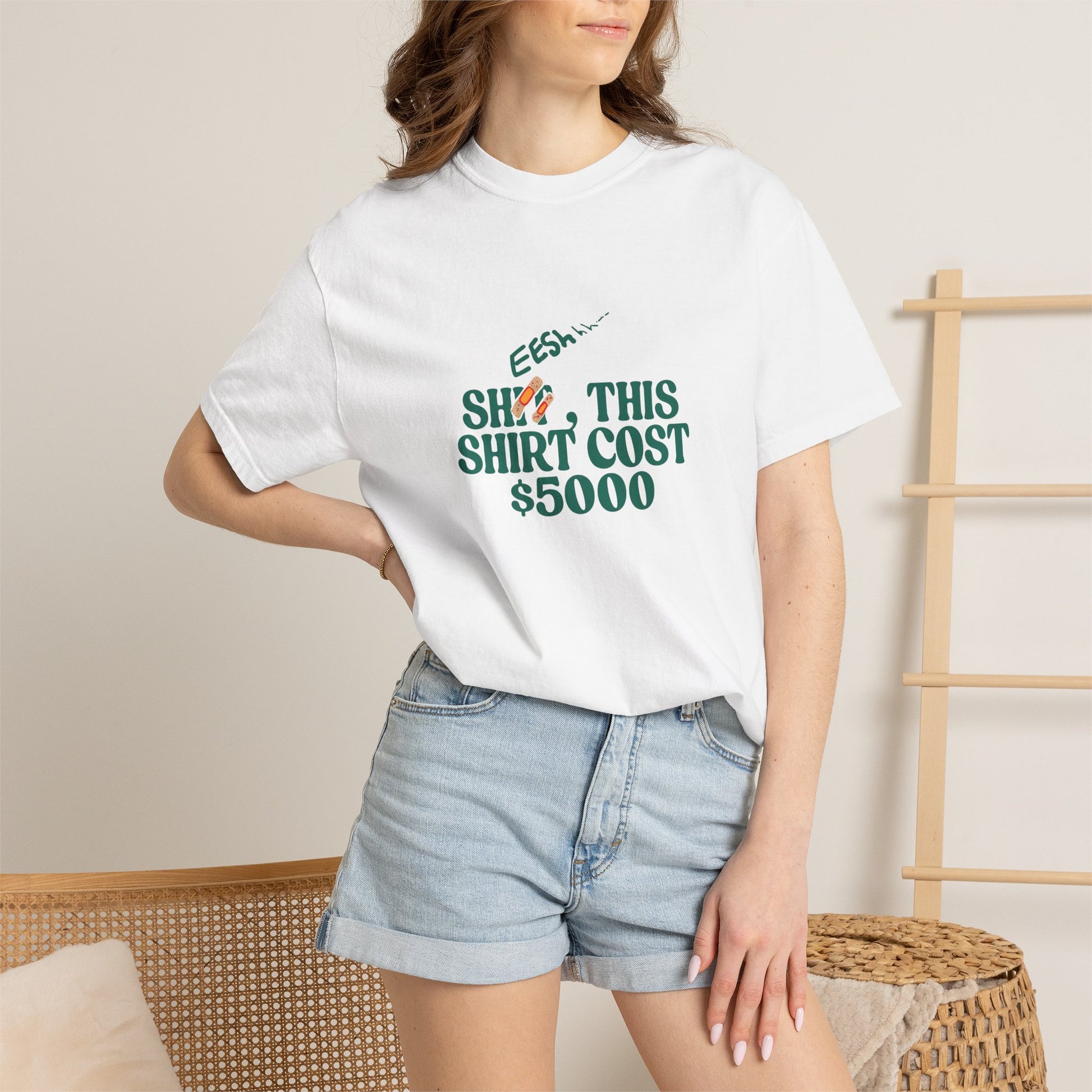 Female model wearing white oversized graphic tee with green statement print