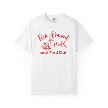 Fish Around and Find Out funny fishing joke tee in navy blue flat lay on wooden dock