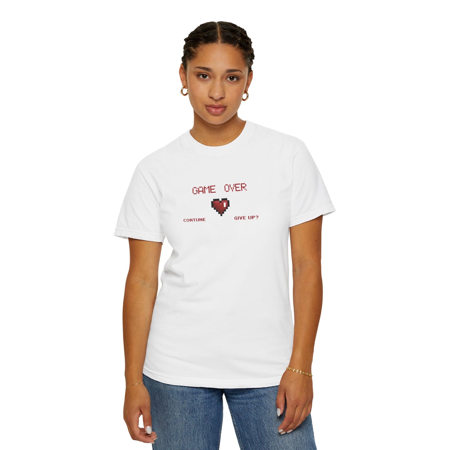 Flat lay of pixel heart tee in warm garment dyed tone showing tubular knit texture and sewn in label
