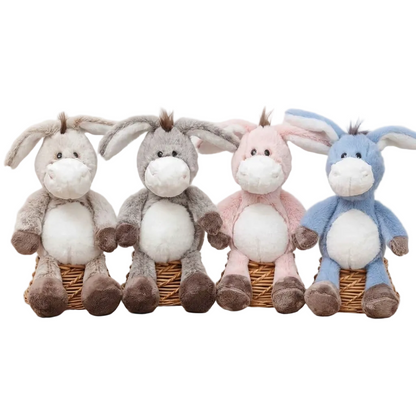 Floppy ear donkey stuffed toy sitting upright on a white background