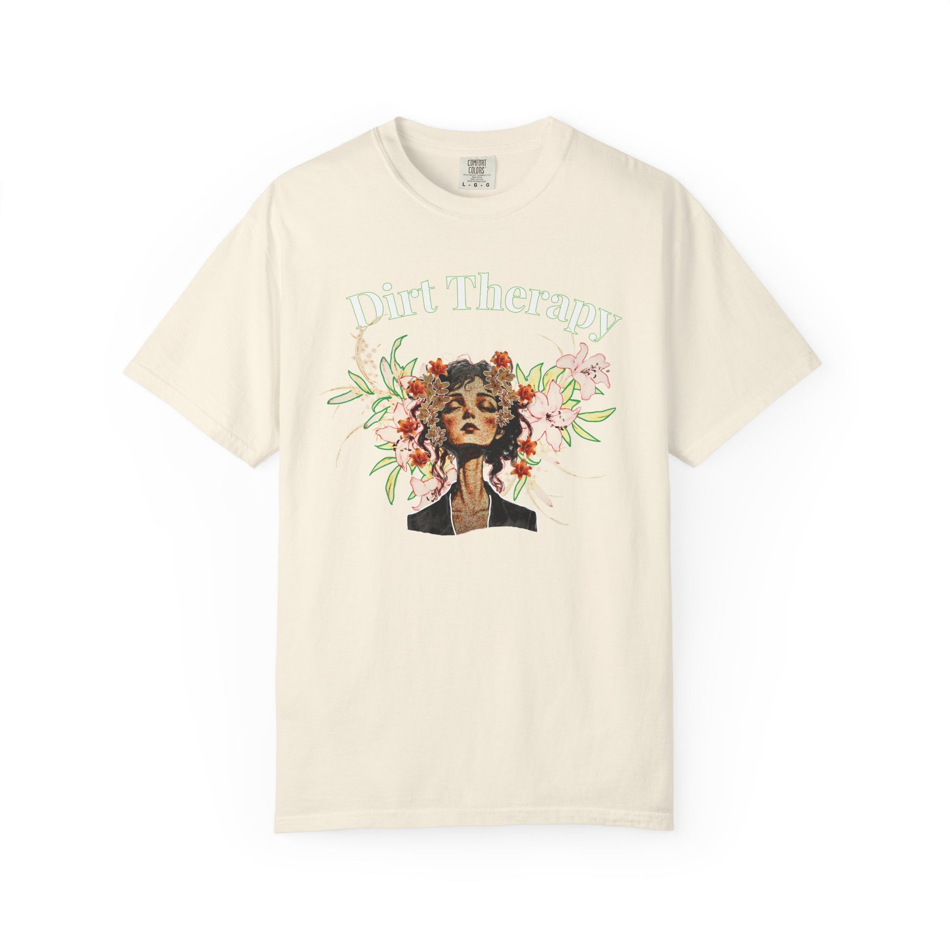 Floral healing printed Comfort Colors tee laid flat on natural linen surface