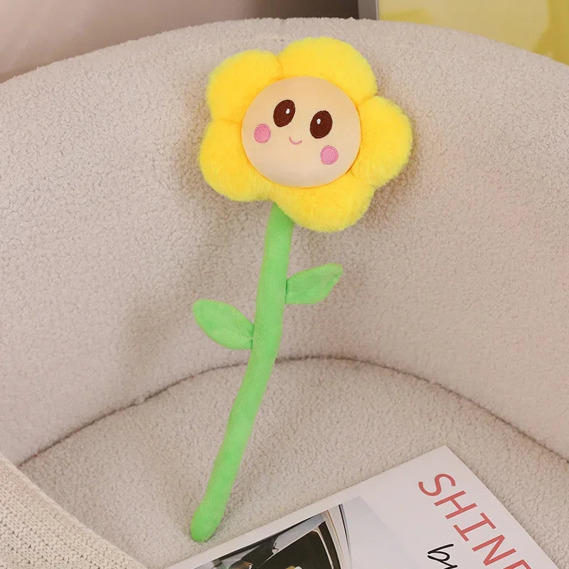 Flower plushie smiley face embroidered detail macro shot

