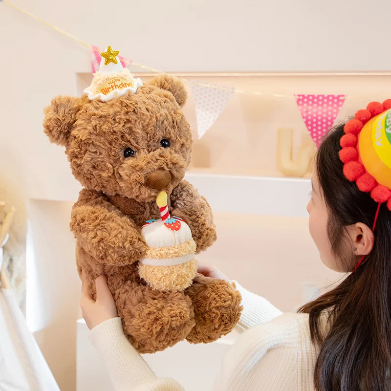 Fluffy birthday bear gift plushie with curly brown fur and party accessories closeup