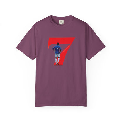 Footballer mid-celebration silhouette inside red number 7 on garment-dyed tee
