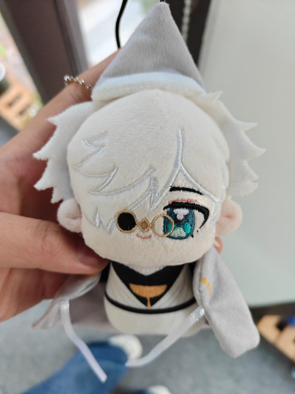 For a front/main shot: Handmade fan-inspired witch master plush toy with white hair and grey witch hat and cloak
