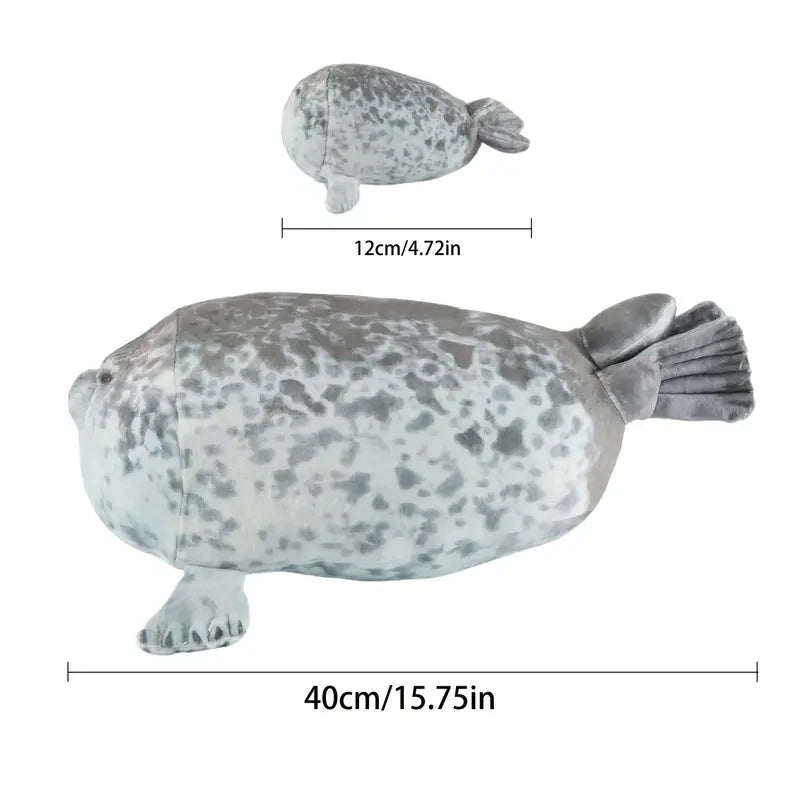 Four baby seal plushies removed from mama seal zipper tummy