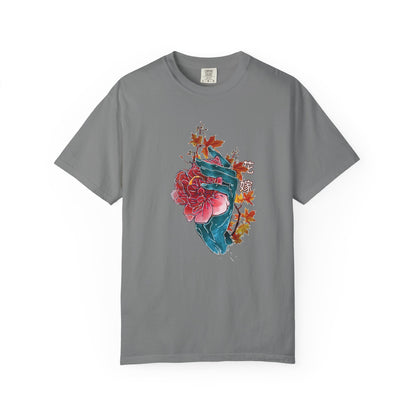 Front view of a teal and rose toned graphic t-shirt on a garment-dyed background.