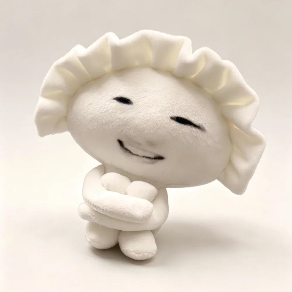 Funny gyoza plush keychain with abstract human-like face close-up