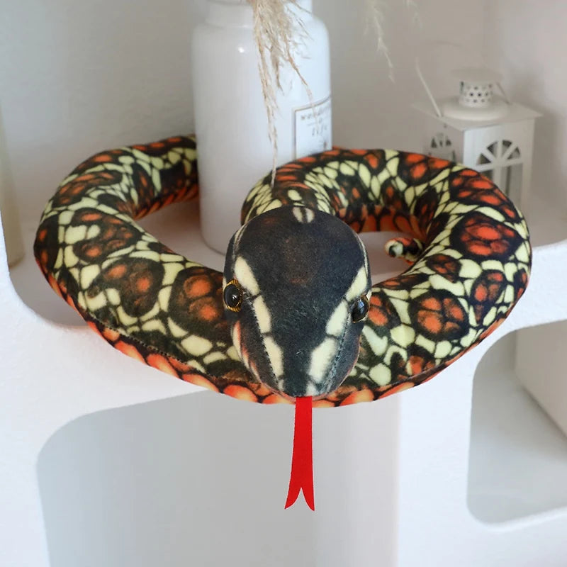 Funny snake plush prank toy 120cm coiled on living room rug