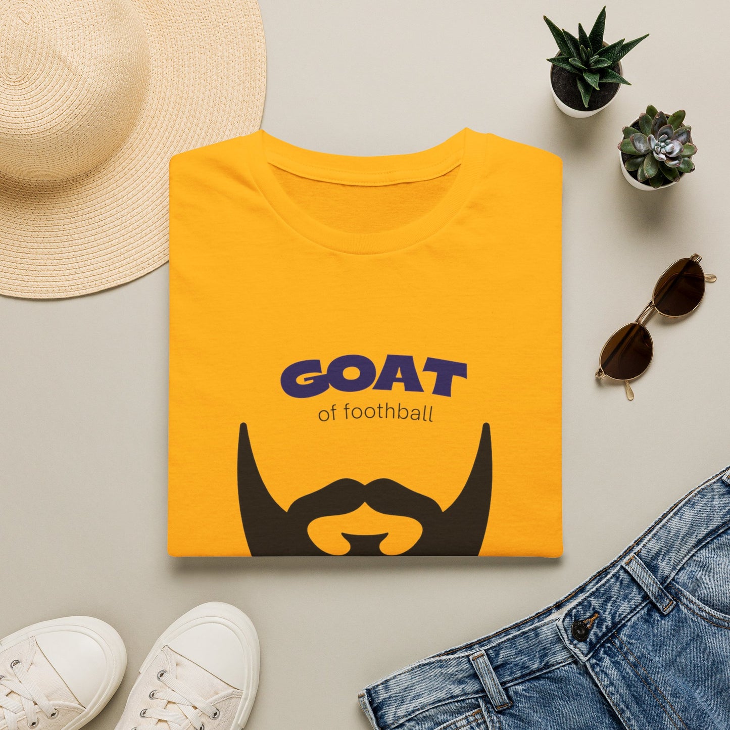 GOAT 10 graphic tee worn with jeans in casual everyday street style