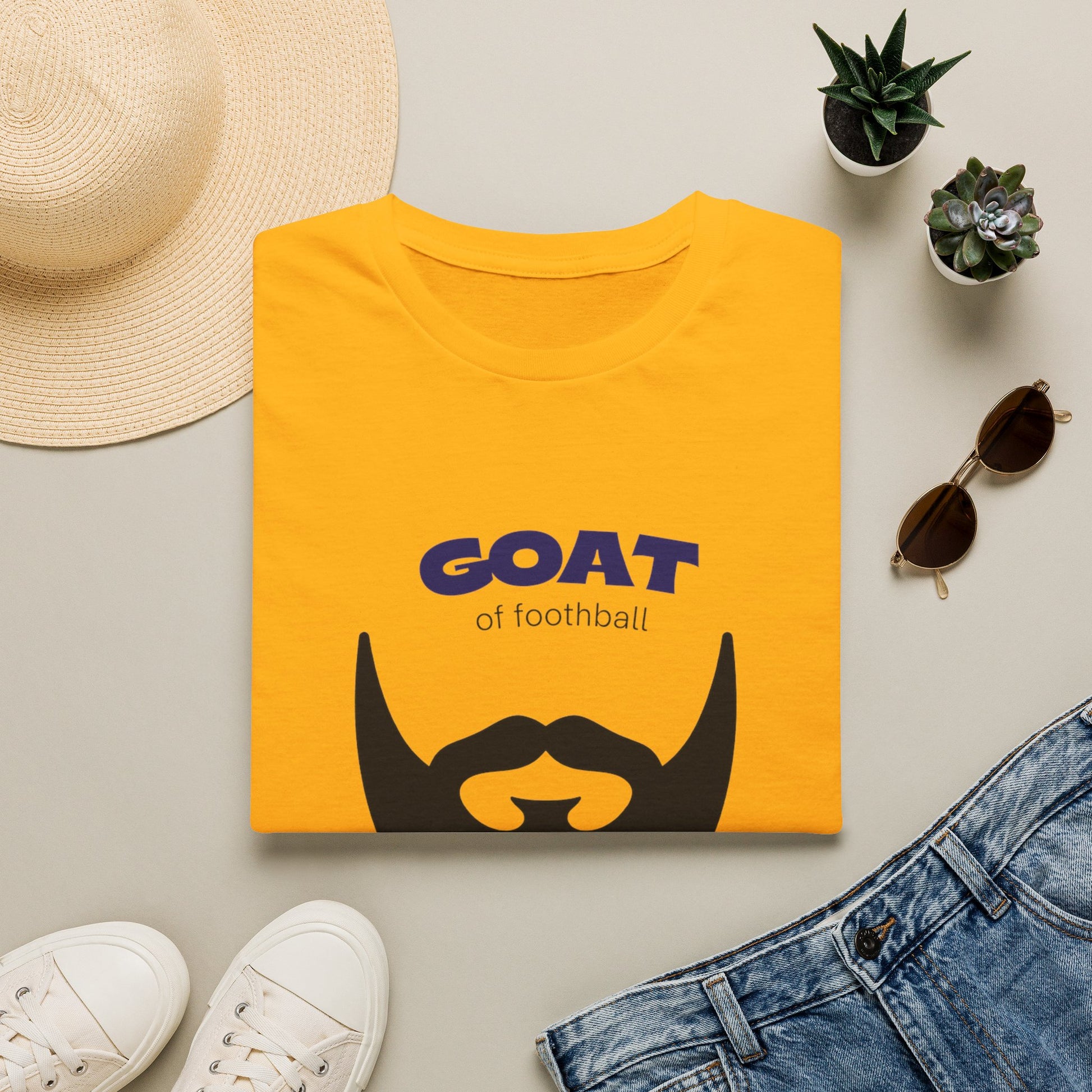 GOAT 10 graphic tee worn with jeans in casual everyday street style