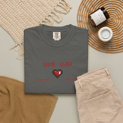 Game over shirt worn at casual game night setting with friends and controllers on the table
