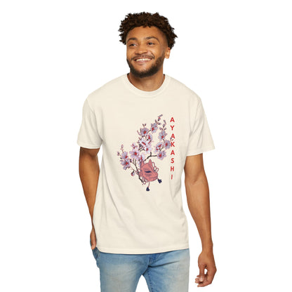 Garment-dyed cotton tee with muted washed tone and yokai mask blossom graphic