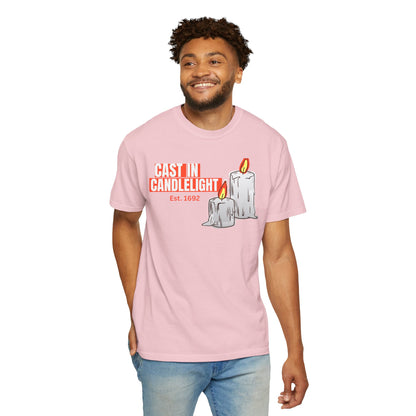 Gaslight Candlelight spooky season graphic tee hanging on wooden hanger against stone wall