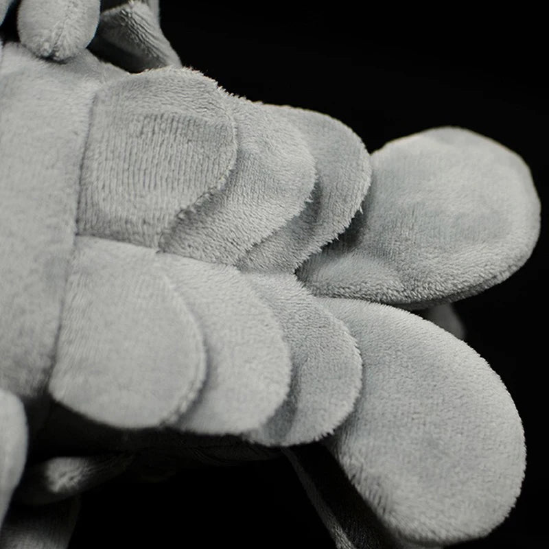 Giant isopod stuffed animal next to a ruler showing full 30cm size