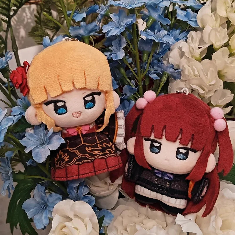 Golden witch and rival anime plush figures side by side