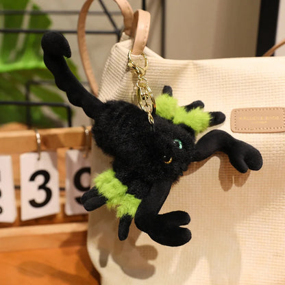 Gothic plush toy scorpion displayed on dark academia bookshelf with candles