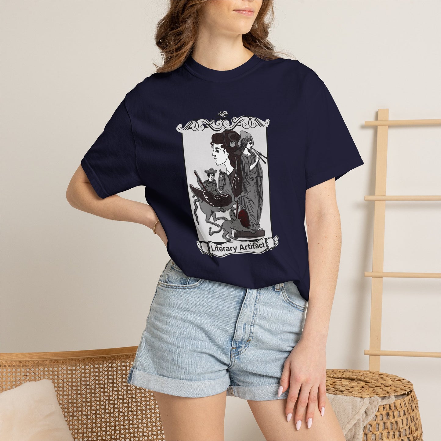 Gothic reader graphic tee in a dark colorway styled on a hanger against a moody bookshelf backdrop