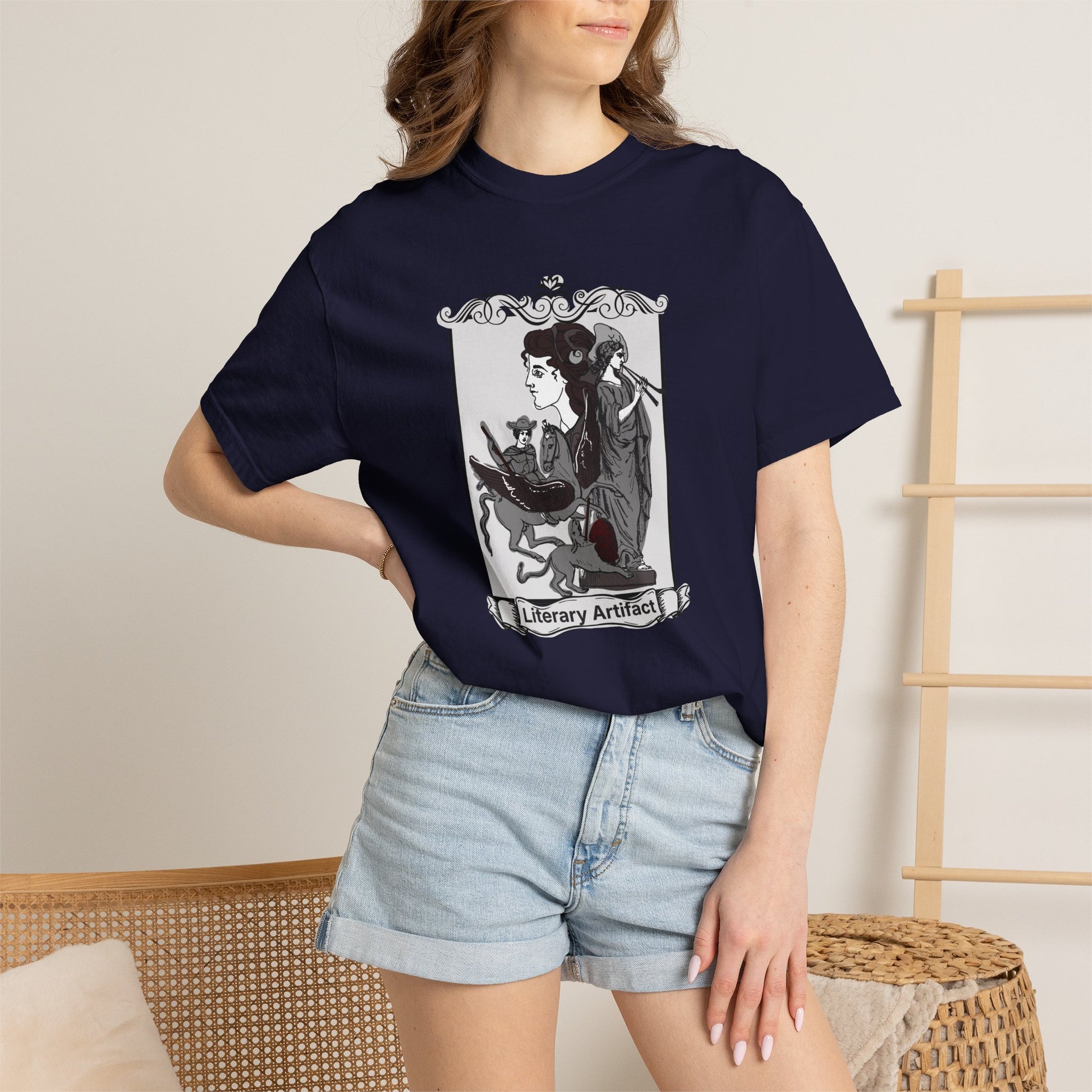 Gothic reader graphic tee in a dark colorway styled on a hanger against a moody bookshelf backdrop