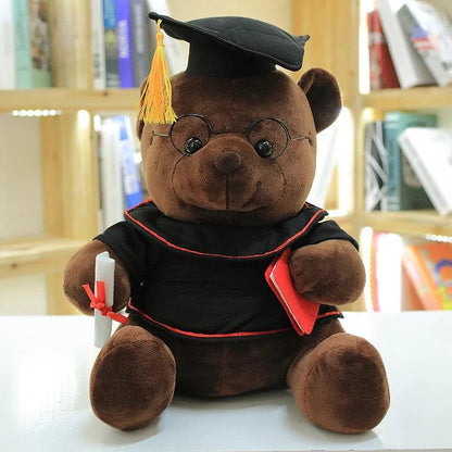 Graduation plush toy bear in pink displayed on desk as a lasting academic keepsake

