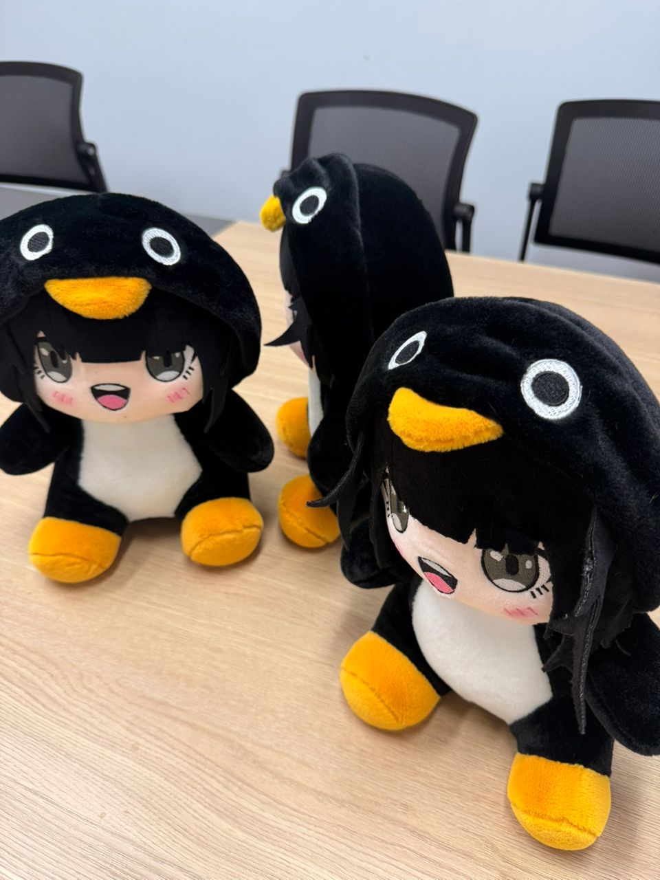 Gugu Gaga Penguin stuffed plush sitting upright on white background
