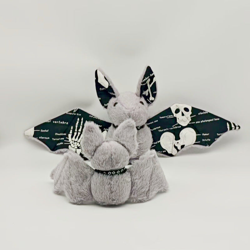 Halloween plushie bat close up showing face and wing detailing