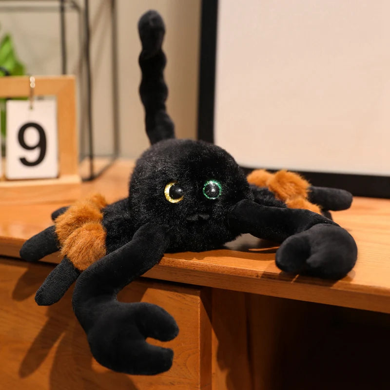 Halloween stuffed animal scorpion plush displayed on spooky dark background with pumpkins