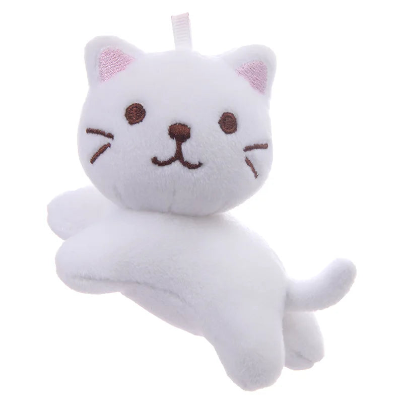 Handmade 12cm cat plushie shown against ruler for size reference