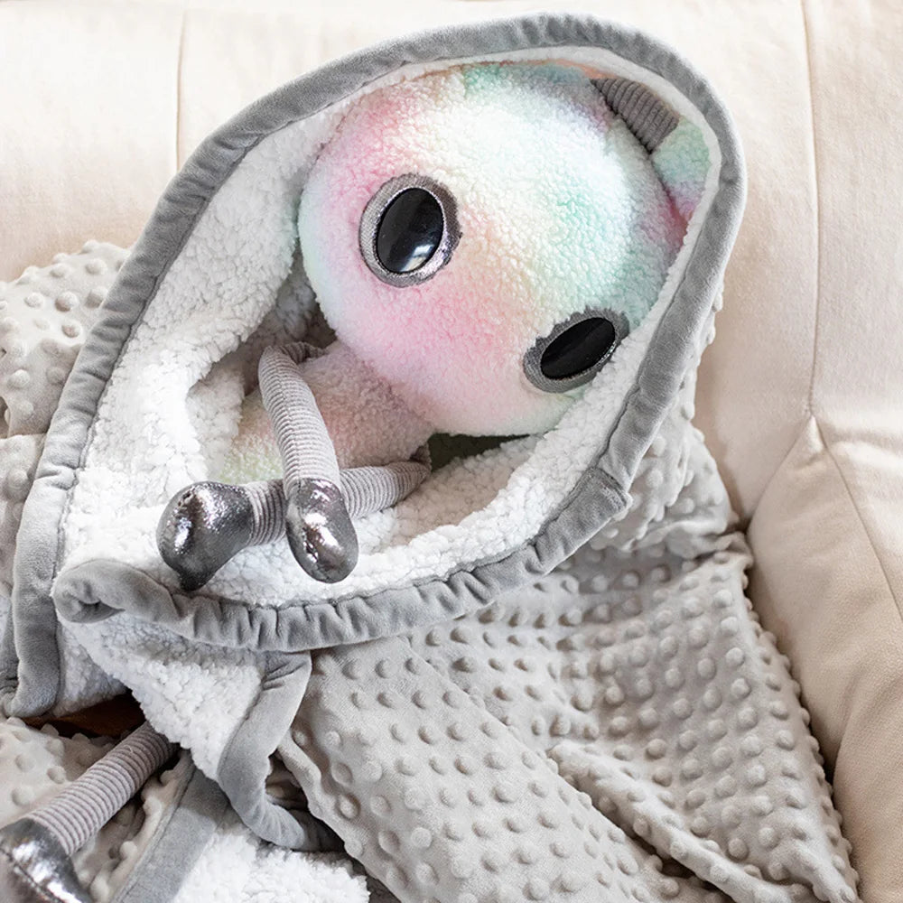 Handmade alien plush doll close up showing dreamy gradient color detail