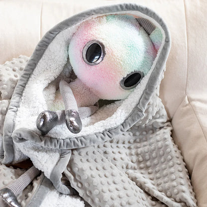 Handmade alien plush doll close up showing dreamy gradient color detail