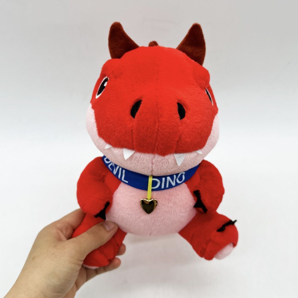 Handmade devil dinosaur plush toy with size reference
