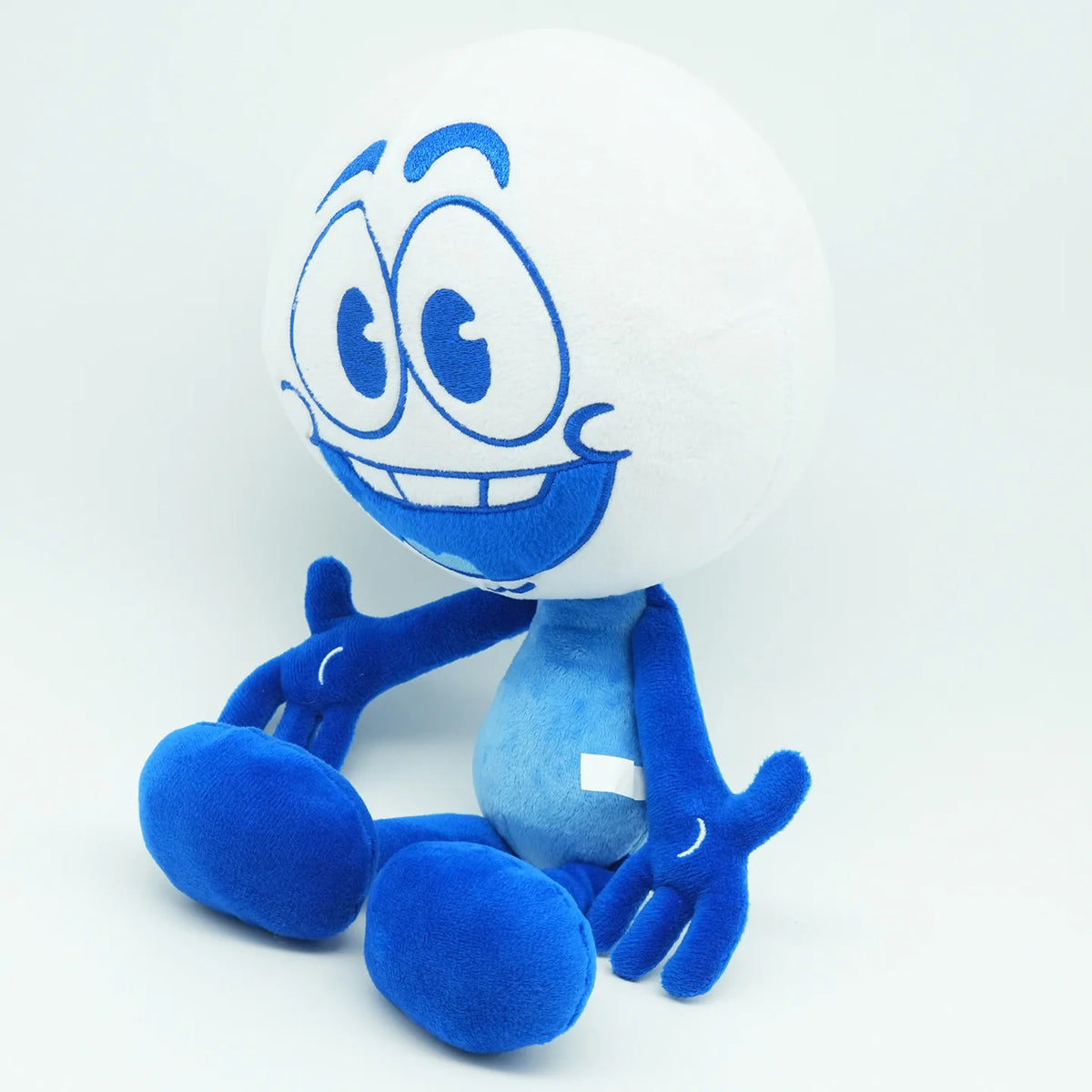 Handmade doodle character plushie close up showing soft plush material and stitching